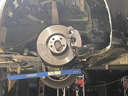 Universal under vehicle engine and gearbox support