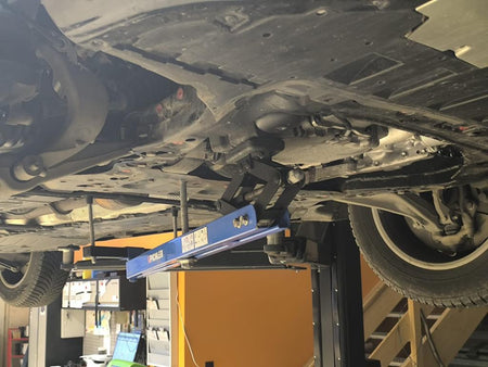 Universal under vehicle engine and gearbox support