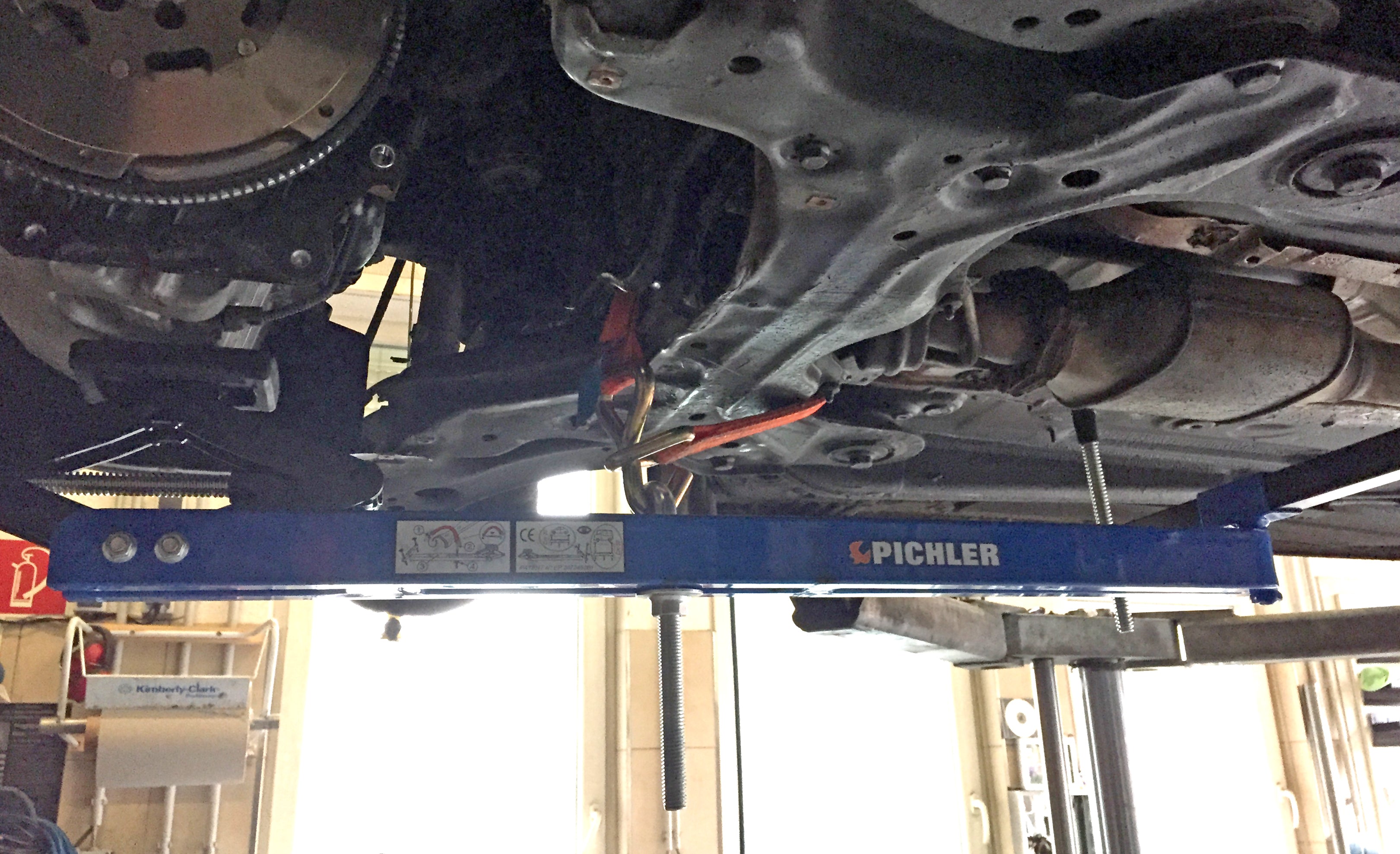 Universal under vehicle engine and gearbox support