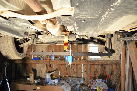 Universal under vehicle engine and gearbox support