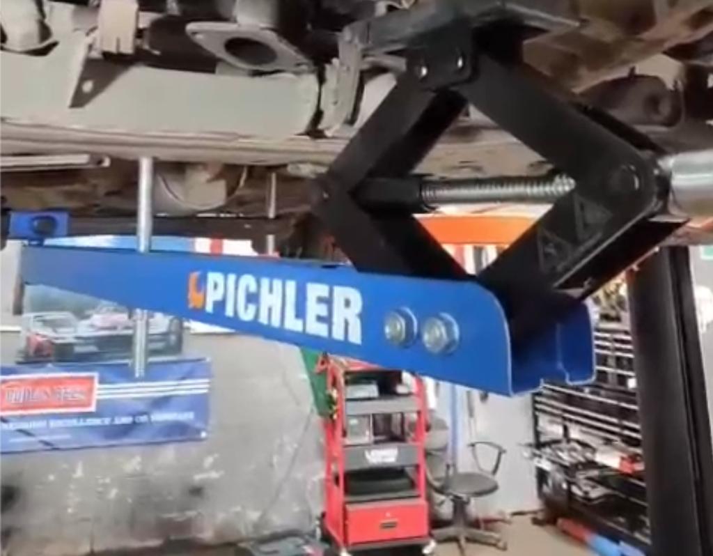 Universal under vehicle engine and gearbox support