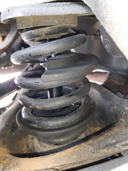 Telescopic internal spring compressor