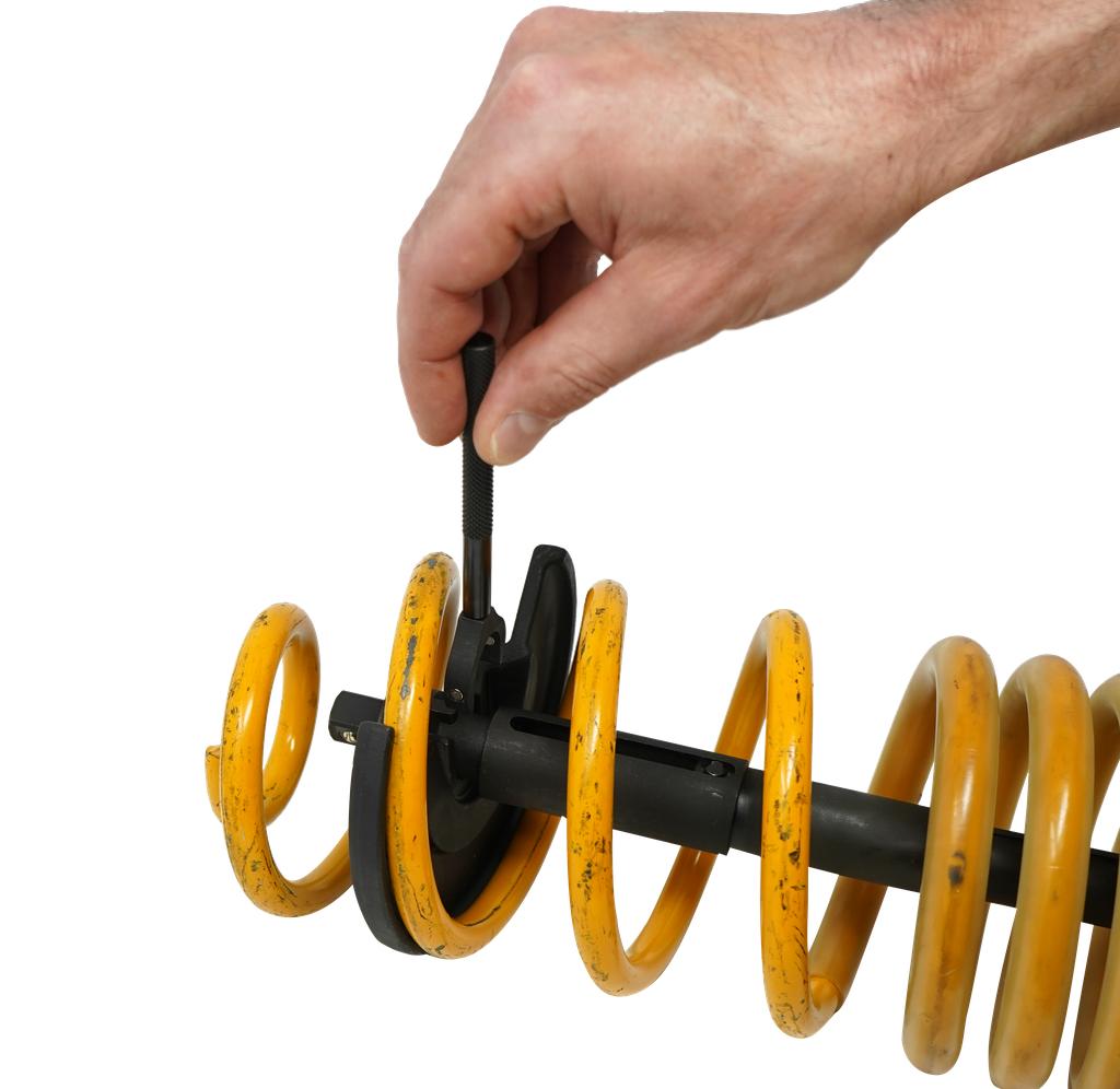 Telescopic internal spring compressor